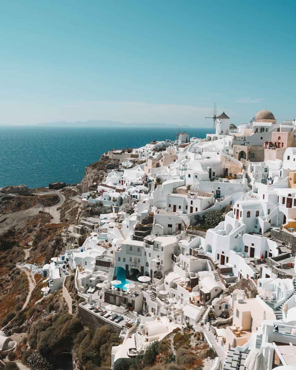 Whitewashed houses and blue domes above the sea in Santorini